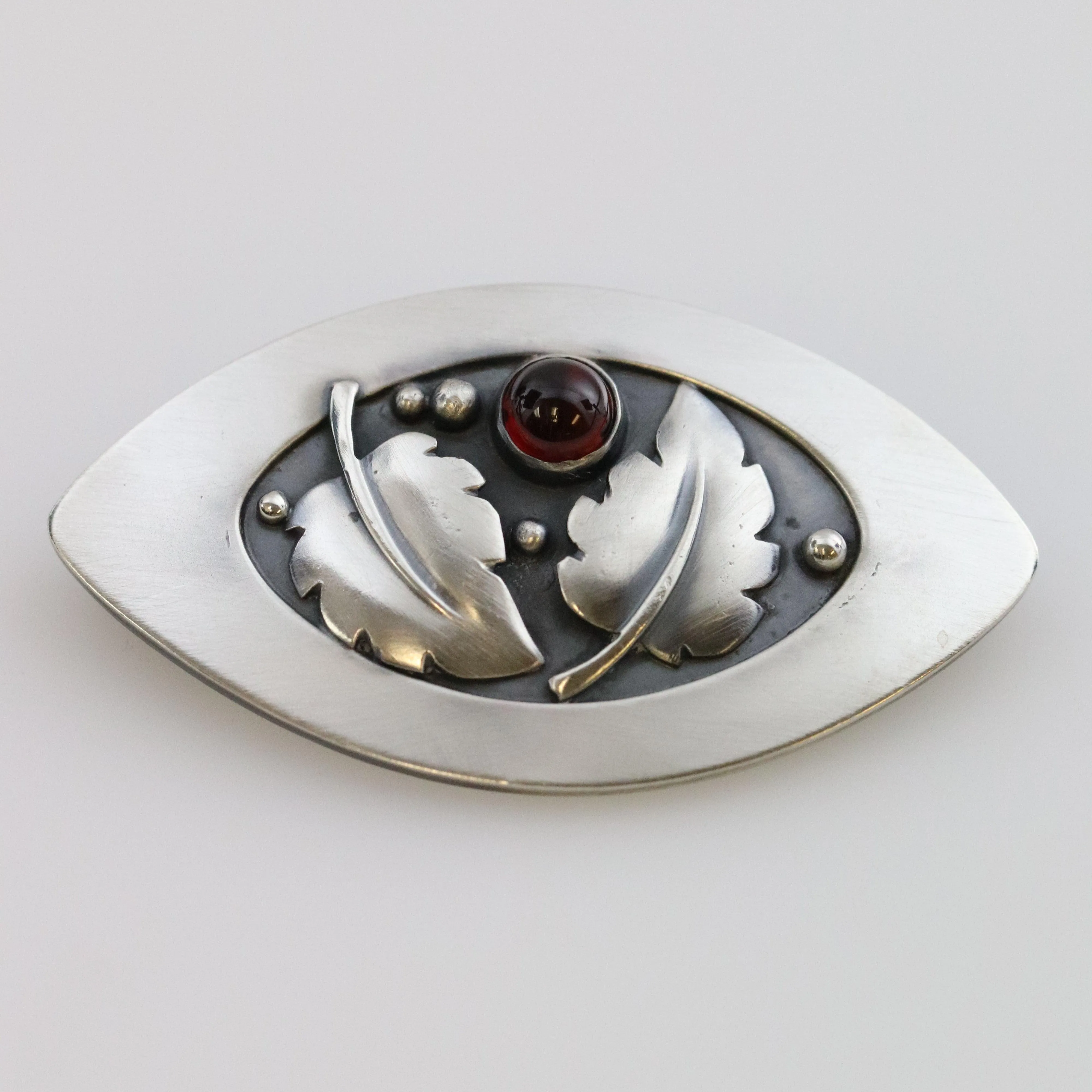 Vintage Lawrence Foss Silver Jewelry | Foliate and Garnet Brooch